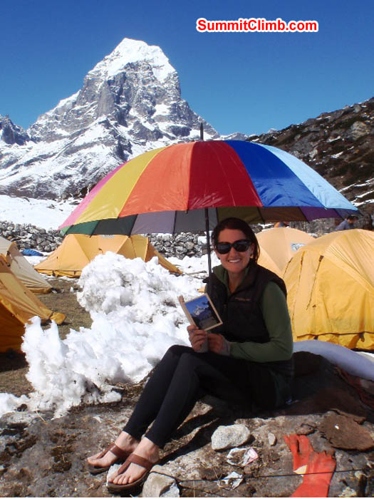 Maggie suns and reads in basecamp. James Barritt Photo.