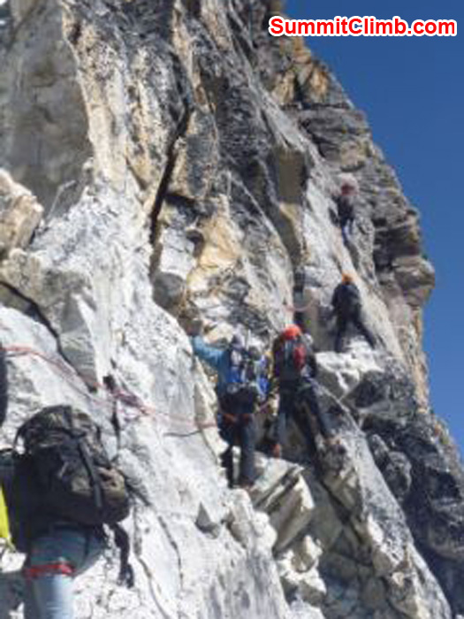 team climbs the yellow tower at 5900m, the crux of the climb, amadablam