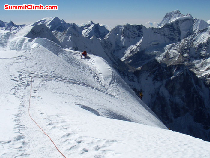 Photo of Korean Team reaching the summit. Kangtega Himal in the background. Photo by Maaike Braat