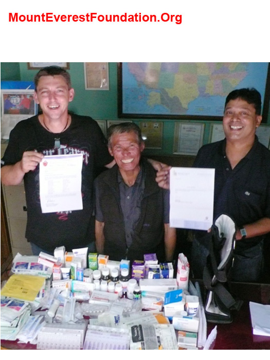 Paul Brophy presenting medicines to Jangbu Sherpa and Murari Sharma of the Mount Everest Foundation. Many Thanks to Mater Misericordiae Hospital Rockhampton and the Archdiocese