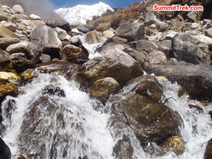 Waterfall near the village of Kote. One of the summits of Mera Peak is visible at the top of the photo. By Andrew Davis