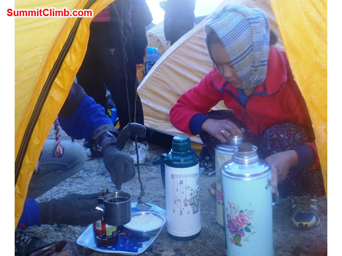 Ms. Yangjie Sherpa serves good morning wakeup tea. Photo by Andrew Davis