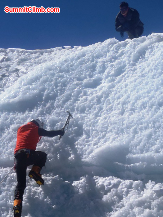 Richard Cotter (BERGHAUS) flashing an ice-wall at Naulekh Glacier. Photo by Andrew Davis.