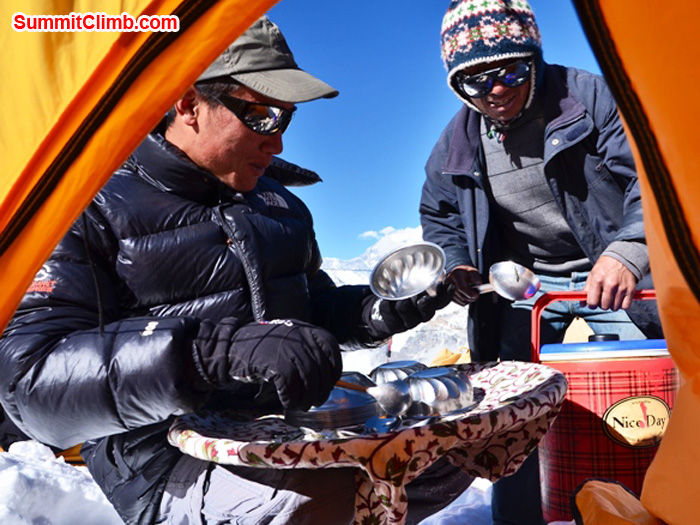 Staff serving delicious lunch to members in tent on Mera Peak. photo by Michael Moritz