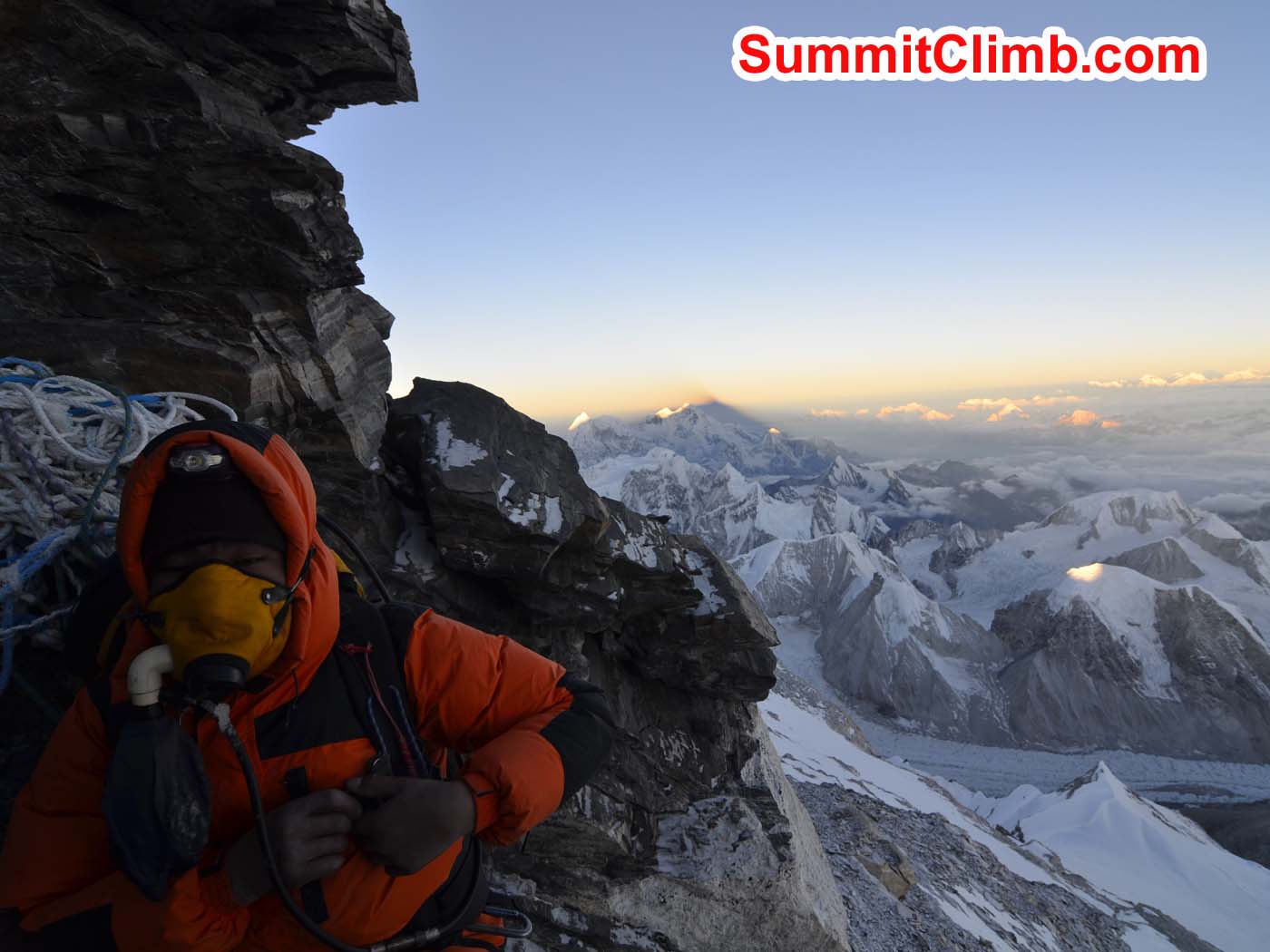 Pasang Sherpa takes a break in the rock band during the ascent to the summit. Dmitri Nichiporov photo