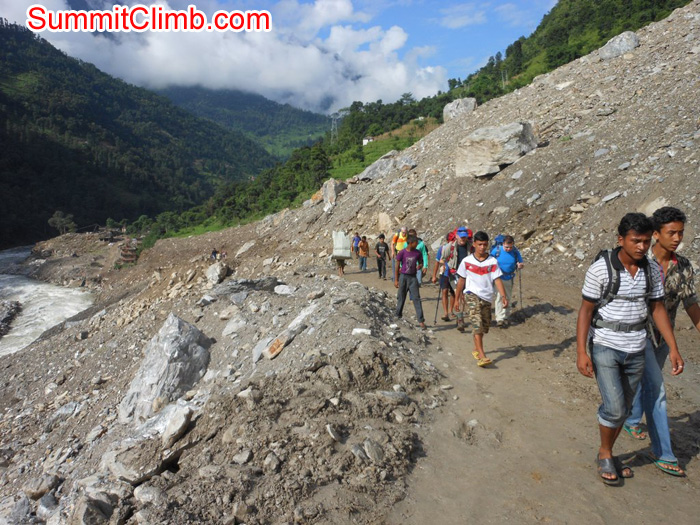 Trkking route through a massive landslide where 167 people were killed. May they Rest in Peace. Stu Frink Photo