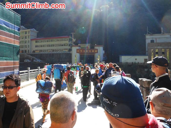 Walking across the Friendship Bridge toward the entry gate into Tibet. Stu Frink Photo