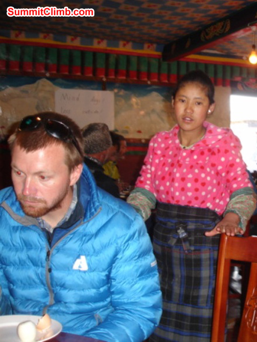 Matt Olsen and Dawa in the dining room in Tingri. Photo by James Grieve