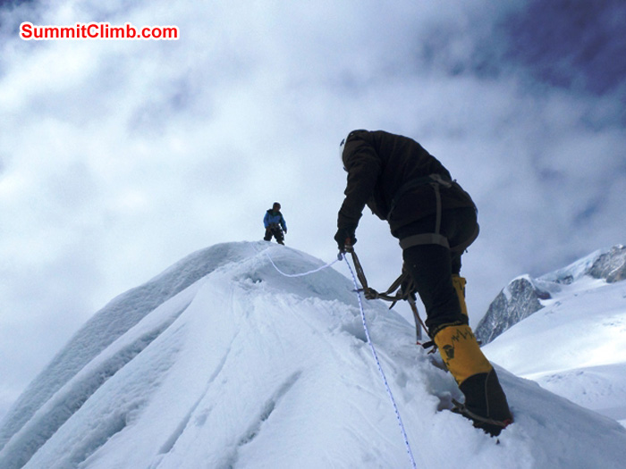 Juergen climbs, Jangbu observes. Ang Pasang Sherpa Photo