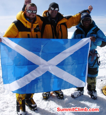 Matt, James, and Jangbu with the Flag of Scotland on Cho Oyu. Matti Sunell Photo