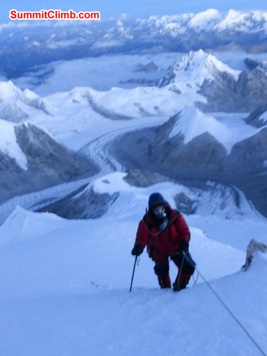 Dan climbing to the summit with camps 3, 2, 1, Abc, Bc, Gyebrag glacier, and Mount Shishapangma in background. Juergen Landmann Photo
