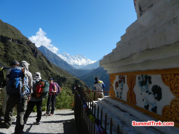 Resting team just below Namche with view of Nuptse, Lhotse, Everest and Ama Dablam. Photo by Stephanie