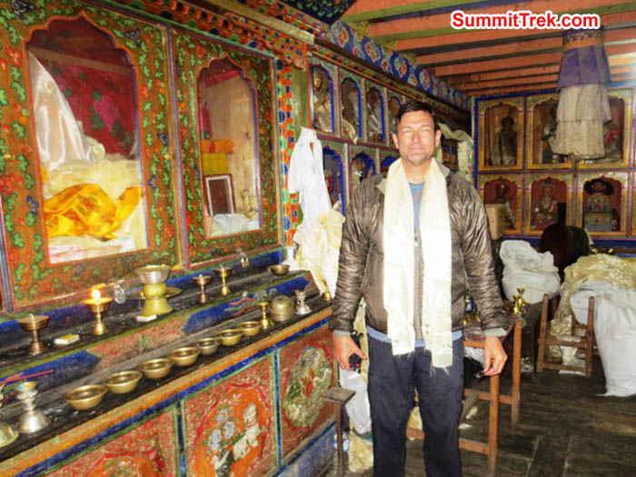 Brian Rolfson poses in front of th altar at the Pangbaoche temple. Hannah Rolfson photo.