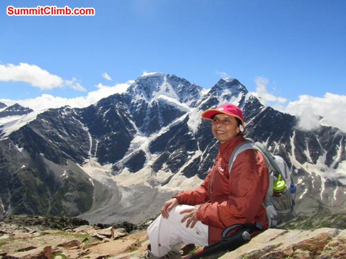 Ms. Pramila Kumari resting behind beautiful mountain.