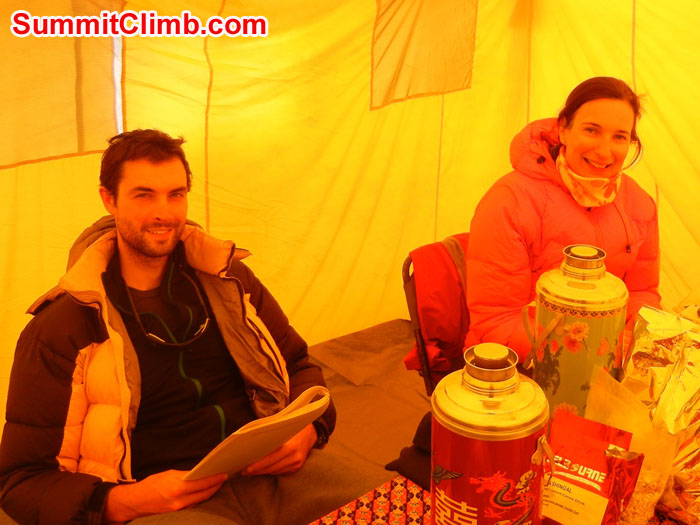 Mia sending an email and Tom reading in our cozy Basecamp  Dining Tent - Photo Scott Patch