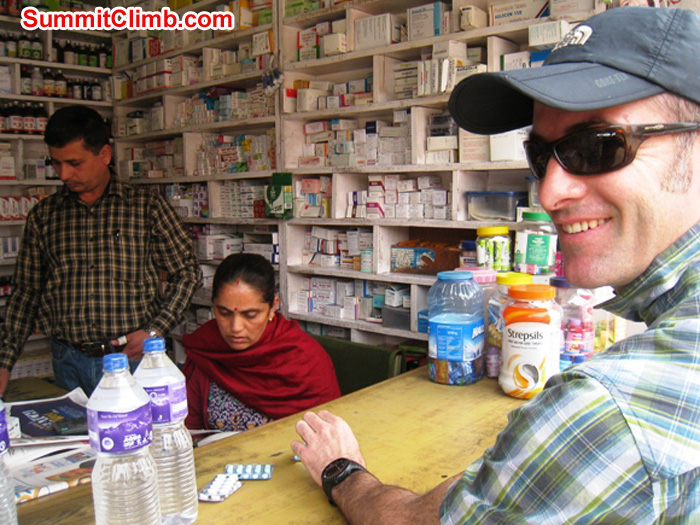Patrick Dougherty purchasing medicines and water in Kathmandu.Scott Smith Photo