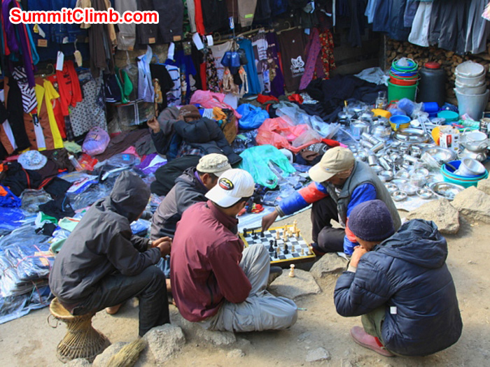 Playing chess in Namche Bazaar Saturday market. Monika Witkowska Photo.