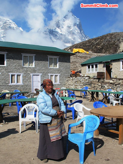 Pasang Sherpani is the boss of the Thughla Lodge. Cholatse in the background. Monika Witkowska Photo.