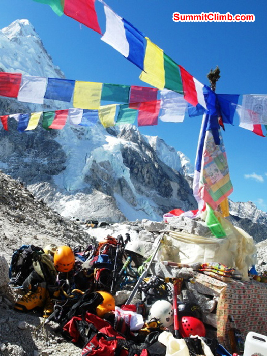Everest and Lhotse team member's climbing gear spread around the alter during the basecamp blessing ceremony. Monika Witkowska Photo.