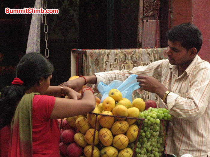 Locals buying fruit locally in street. Photo Rares Voda