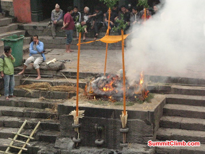  9.	Hindu Cremation at Pashupati Temple on the Bagmati River in Katmandu Nepal . Burning Funeral Pyres on the riverbanks of the Bagmati River that flows through the Kathmandu Valley. Photo Rares Voda