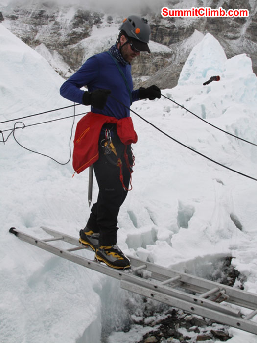 Chris Longacre practices a ladder crossing in the Khumbu Glacier near basecamp. Monika Witkowska Photo.
