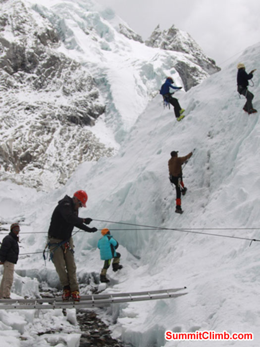 Team practices ladder crossings and ice climbing ascending and descending in the Khumbu Glacier near basecamp. Monika Witkowska Photo.