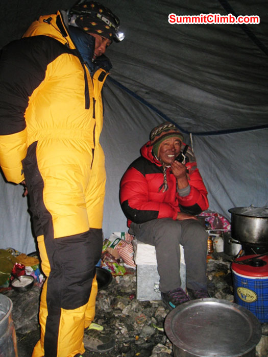 Sange Sherpa Watches Kipa Sherpa Make a Radio Update in Camp 2.