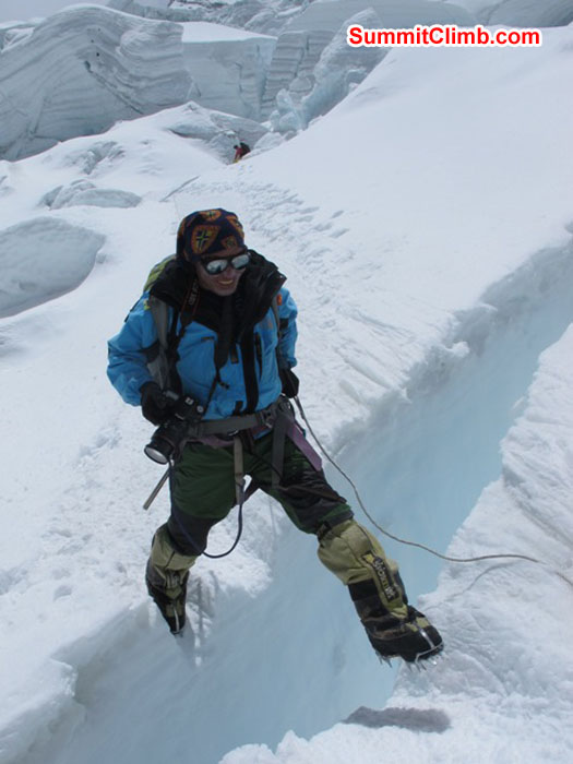 Jangbu Sherpa jumps a crevasse in the Khumbu Icefall. Monika Witkowska Photo