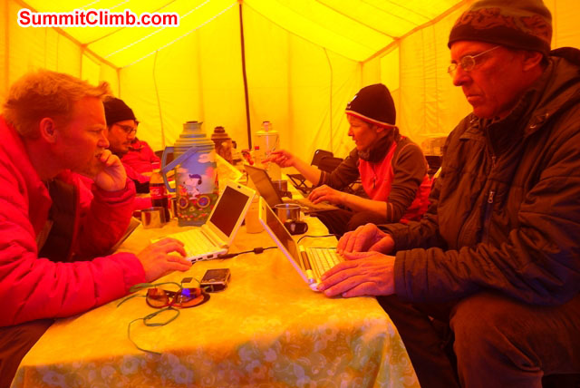 Team works on computers and different tech stuff in the dining tent. Photo by Anne-Mari Hyrylainen
