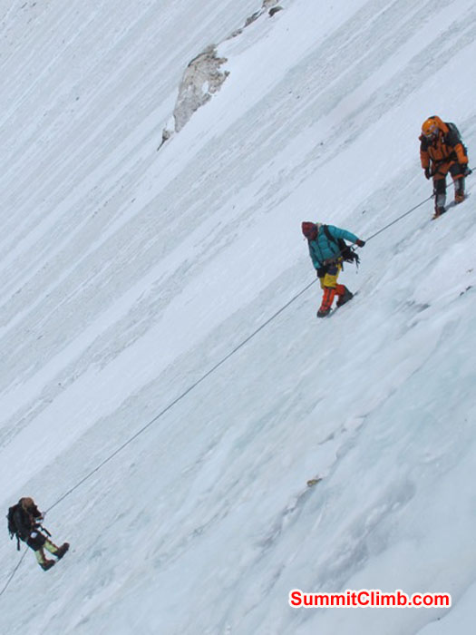 Team climbing the steep Lhotse face to camp 3 at 7000 metres - 23,000 feet. Monika Witkowska Photo.