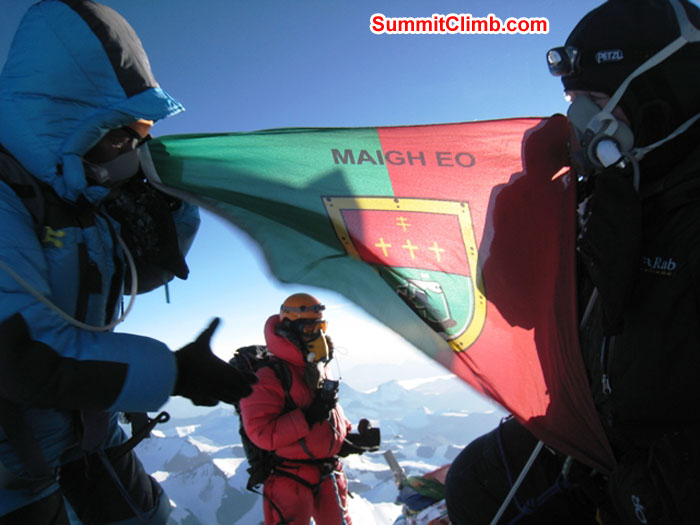 Jangbu Sherpa and Kieran Lally holding the County Mayo flag on the Summit of Everest while a Sherpa stands in the background. Photo by Scott Smith.JPG