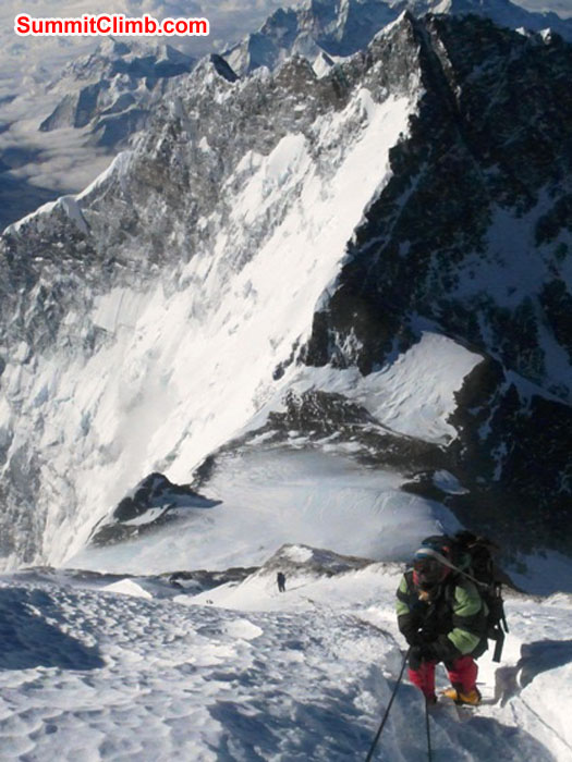 Mingma Sherpa climbs to the balcony. The South Col is below in Lhotse in the background. Photo by Monika Witkowska.