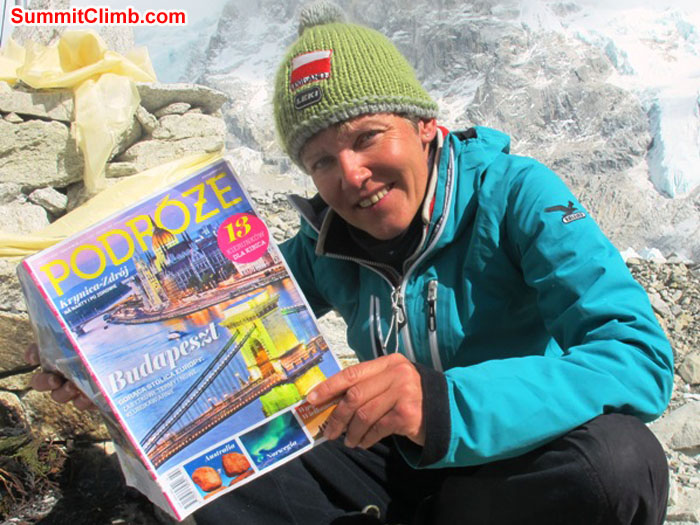Monika Witkowska poses in basecamp with the magazine she writes and photographs for. Kieran Lally Photo.JPG