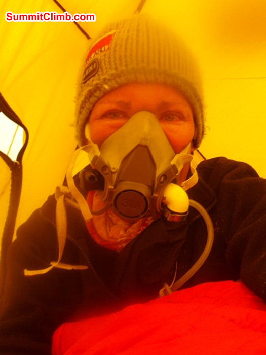 Monika Witkowska trying on her oxygen mask at the south col. Self Photo.