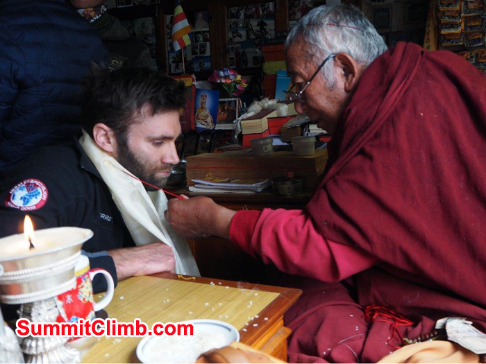 Everest Climbing member  receiving a blessing from the local Buddhist Lama in Pangboche.