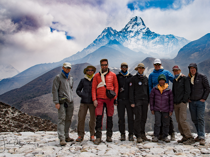Everest Climber posing for photo during trek background Amadablam