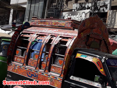 Decorated Suzuki passenger van in Raja Bazaar, Rawalpindi