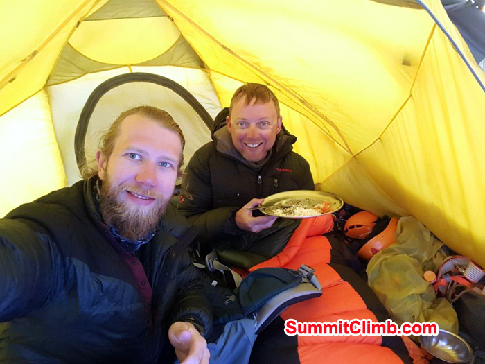 Members enjoying meals inside tent