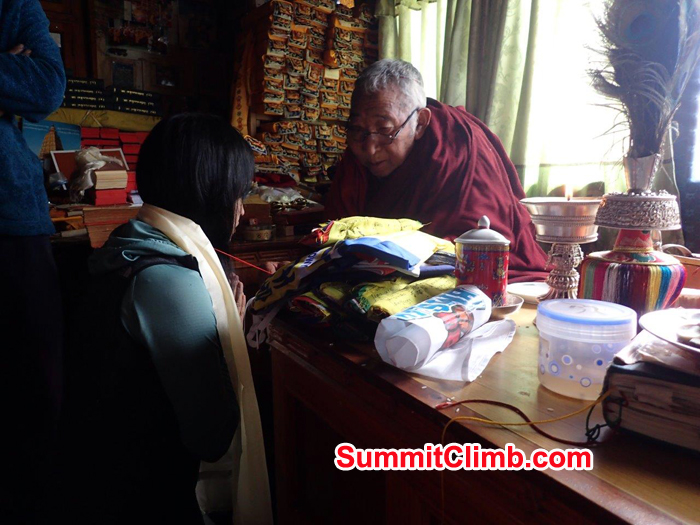 Everest Glacier Climbing member  receiving a blessing from the local Buddhist Lama in Pangboche.