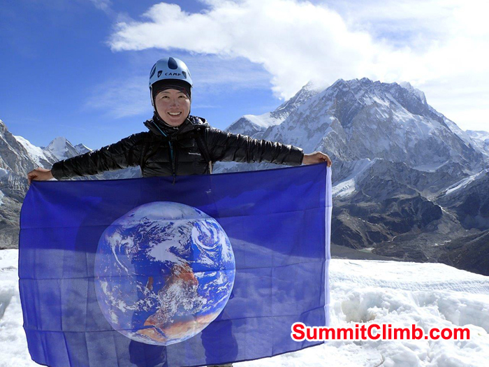 Summit of Lobuche Michiko Eto with World Flag