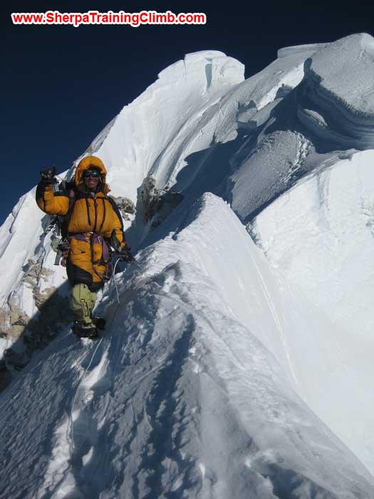 Jangbu Sherpa fixing rope on the Summit Ridge of Mount Baruntse. Photo Markus