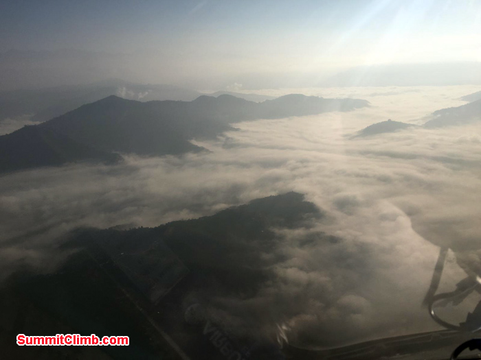 flying above the clouds while flying to Lukla airport via helicopter